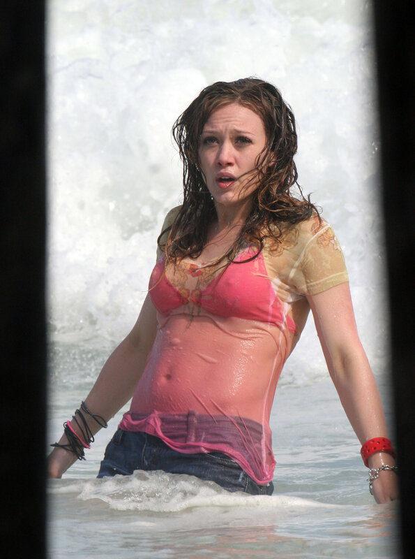 woman in wet clothes at beach