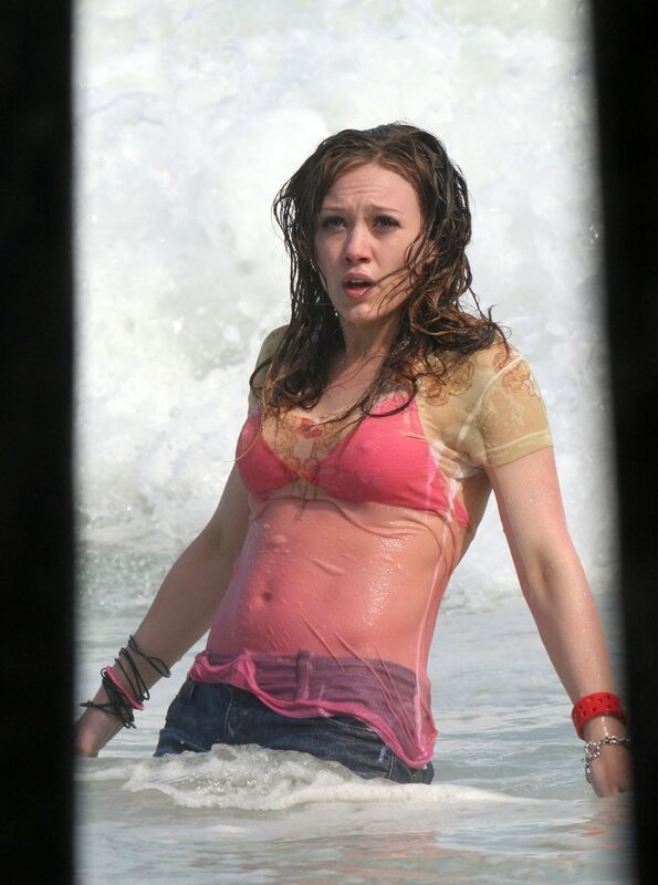 woman in wet clothes at beach