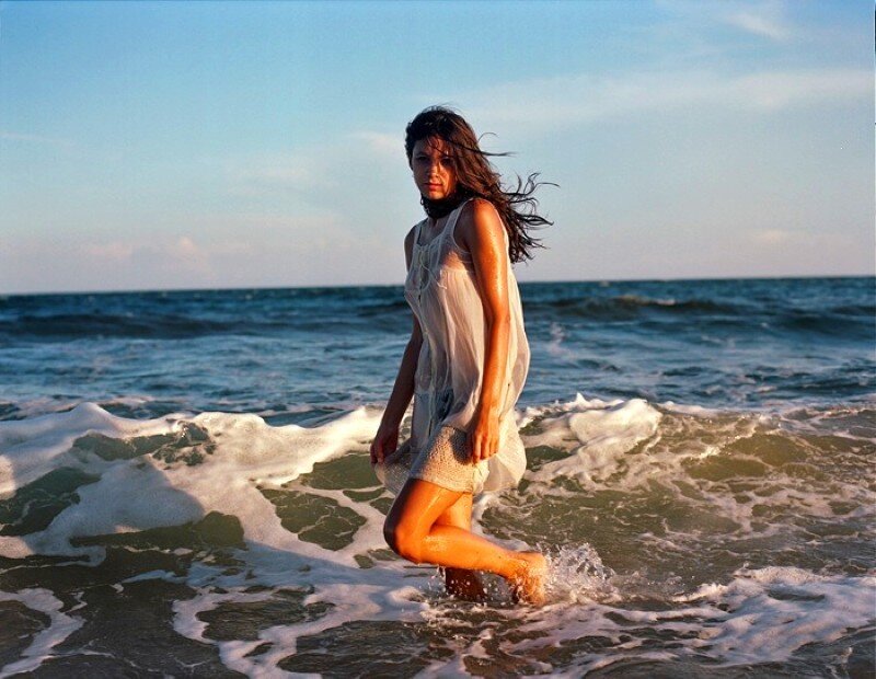 woman in wet dress at beach