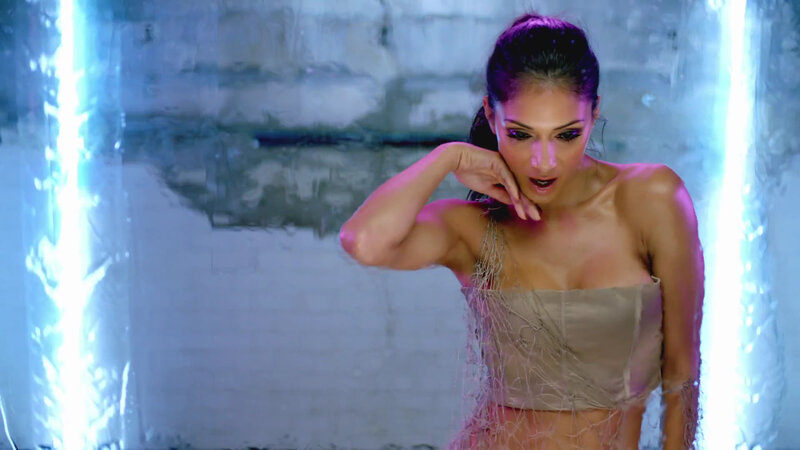 woman in wet outfit under lights