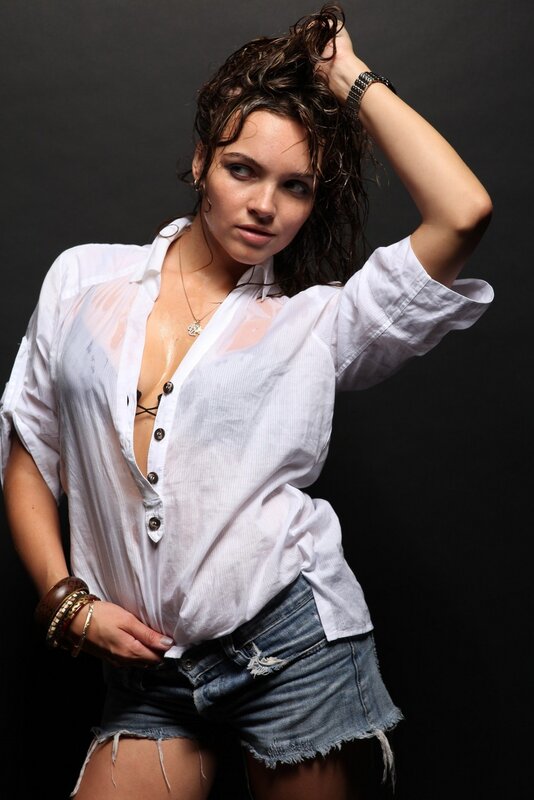 woman in wet shirt and denim shorts