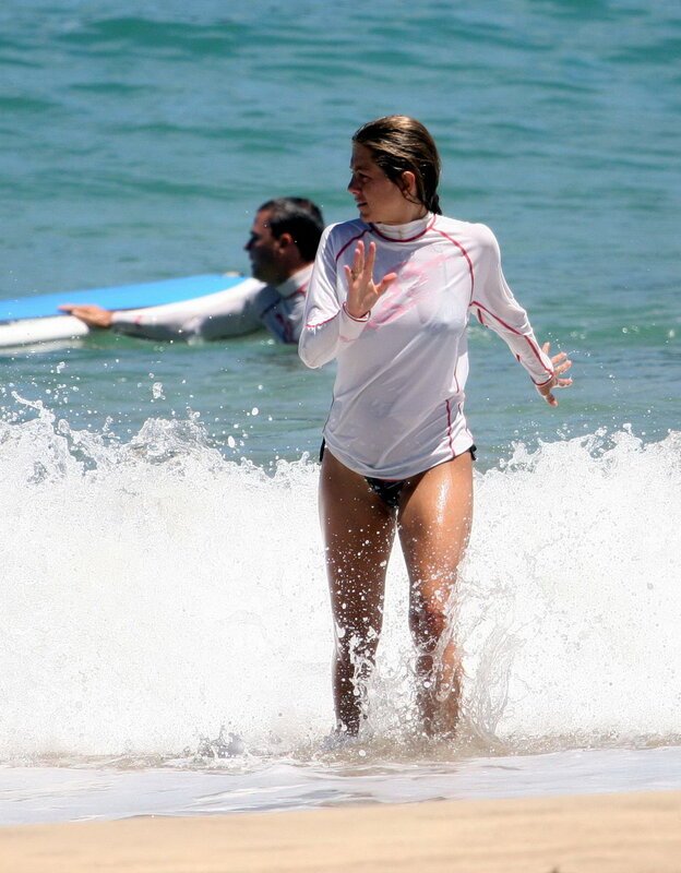 Woman in wetsuit at beach