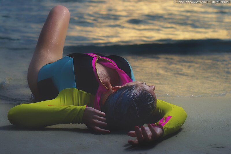 woman in wetsuit on beach