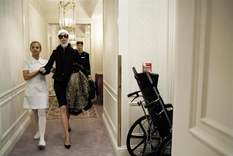 Woman in wheelchair hallway