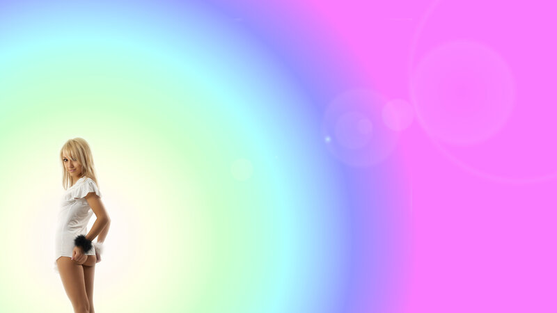 woman in white against rainbow