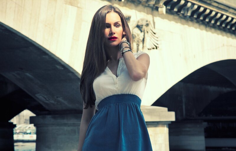 Woman in White and Blue Dress — Dramatic