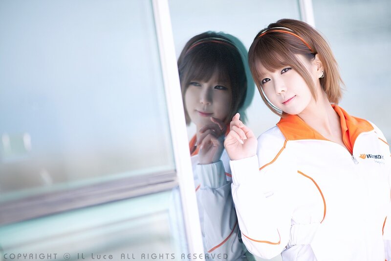 woman in white and orange jacket