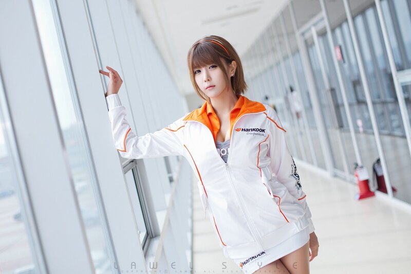woman in white and orange jacket