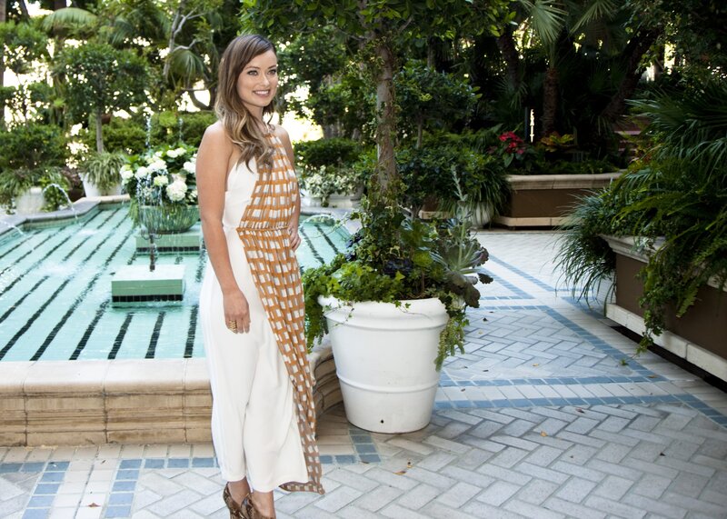 Woman in white and orange jumpsuit
