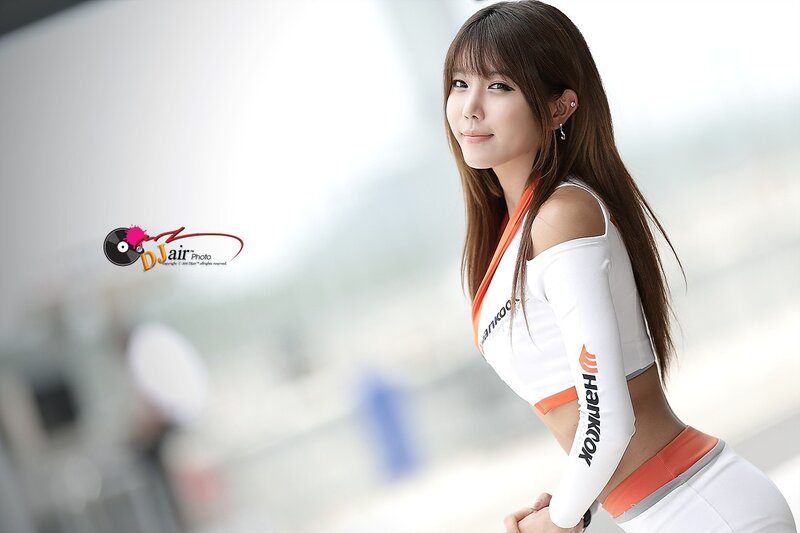 Woman in White and Orange Outfit — Neutral, Photograph