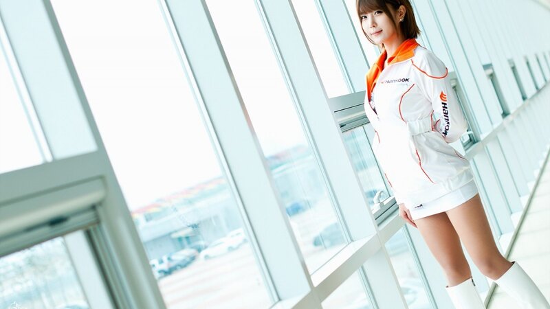woman in white and orange uniform