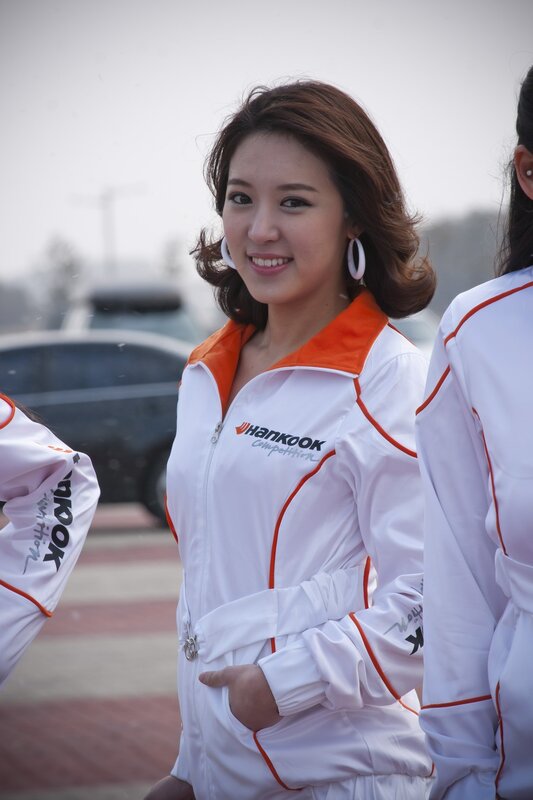 woman in white and orange uniform