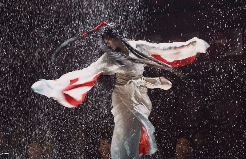 Woman in White and Red Robe — Dramatic