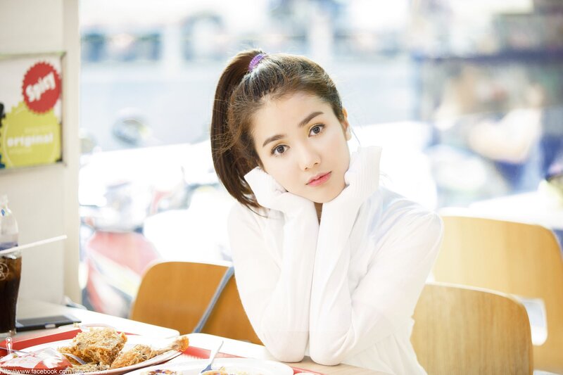 woman in white at a restaurant
