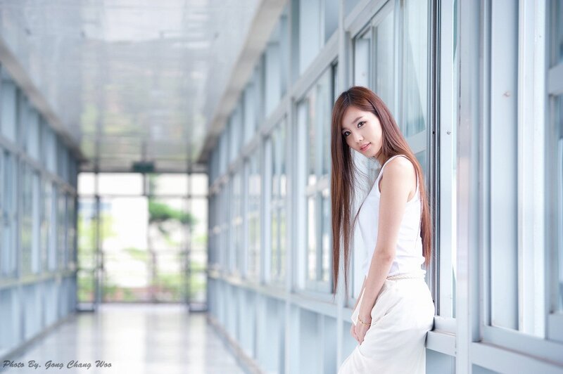 woman in white at corridor