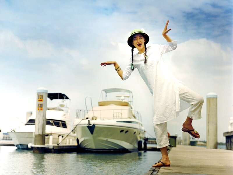 Woman in white at marina
