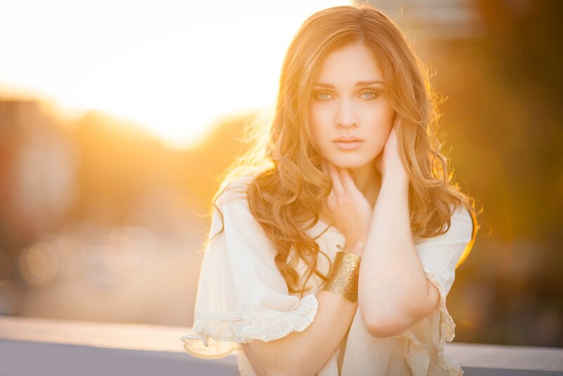 woman in white at sunset