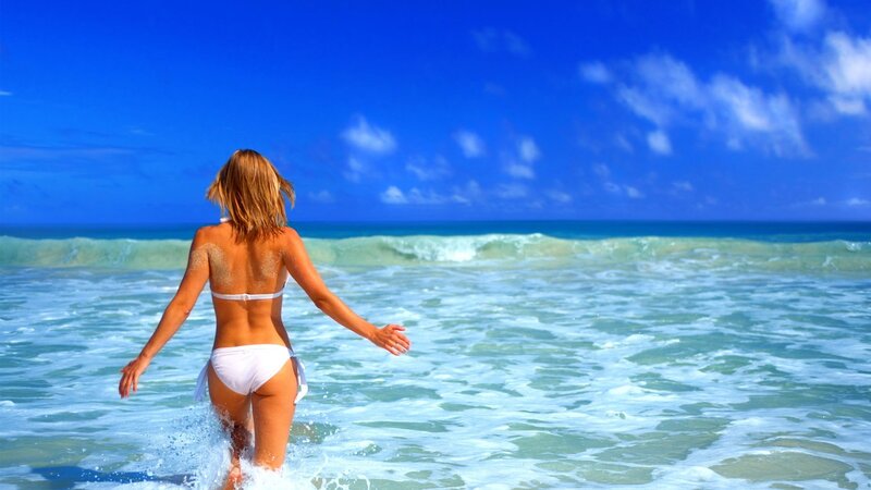woman in white bikini at beach