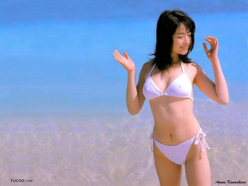 Woman in white bikini at beach