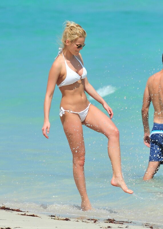 Woman in white bikini at beach