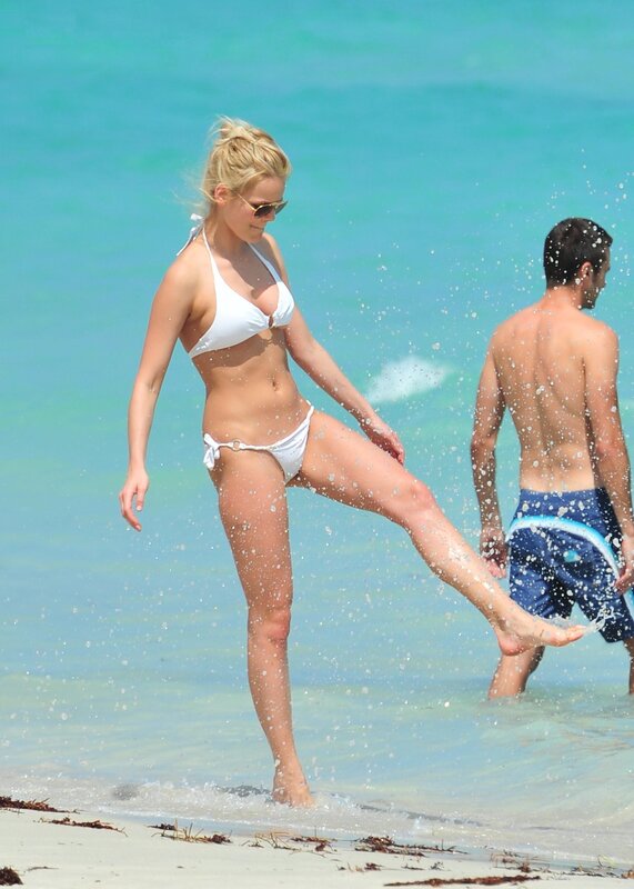 Woman in white bikini at beach