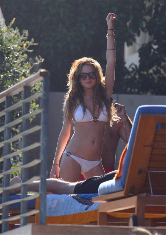 woman in white bikini at pool