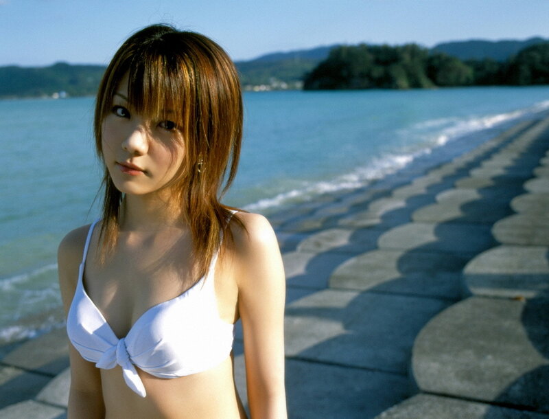 Woman in white bikini at seaside