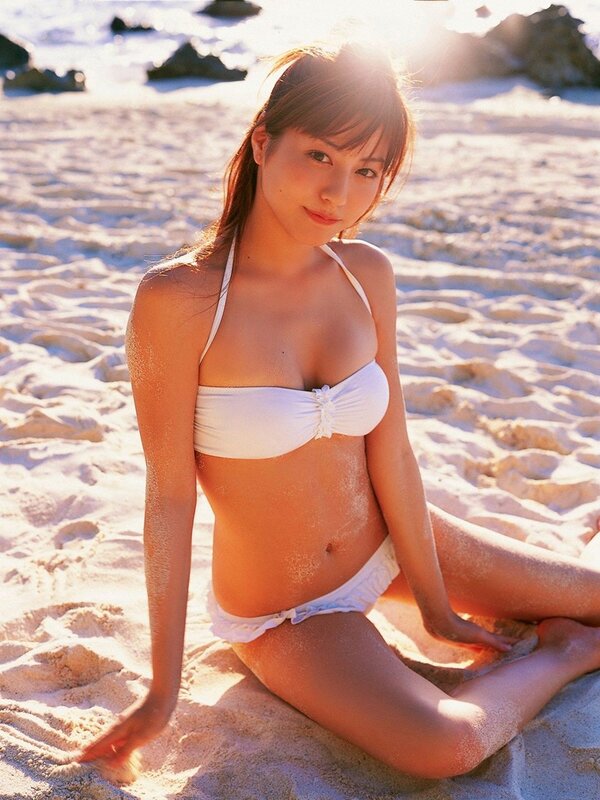 Woman in white bikini on beach