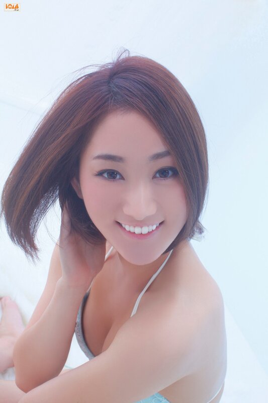 woman in white bikini smiling