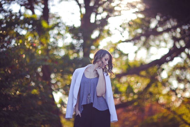 woman in white blazer outdoors