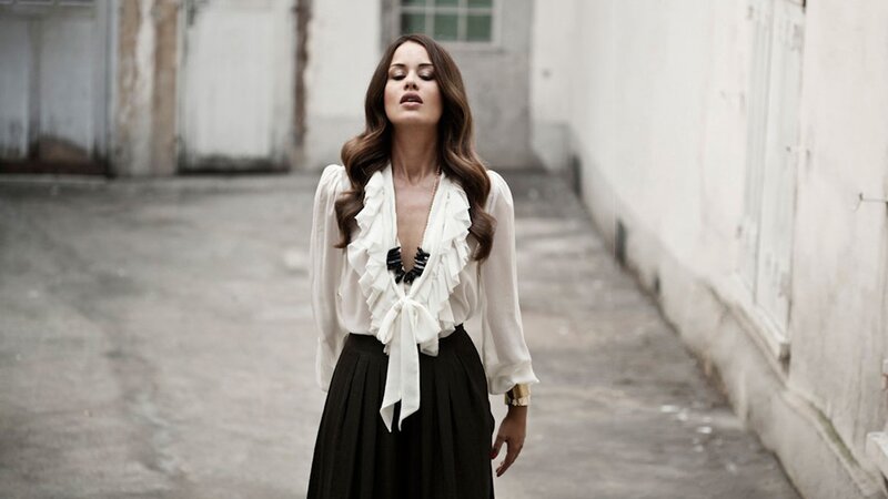 woman in white blouse and black skirt