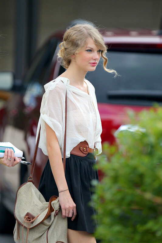 woman in white blouse and black skirt
