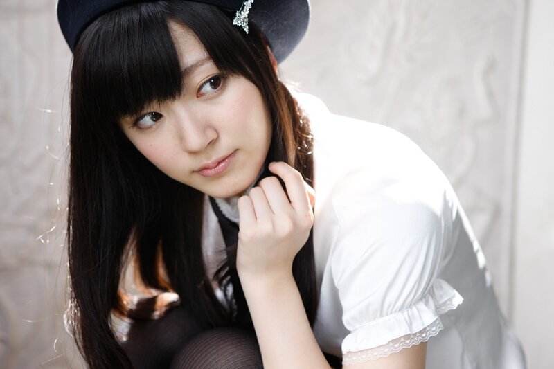 woman in white blouse and hat
