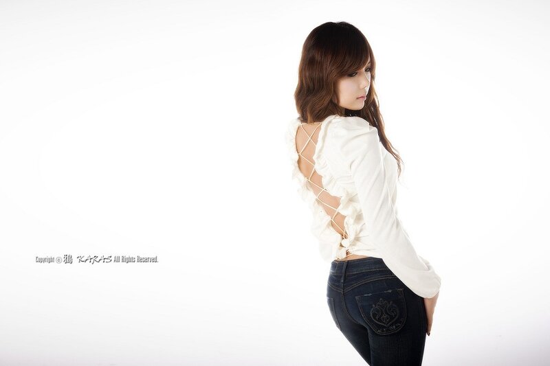 woman in white blouse and jeans