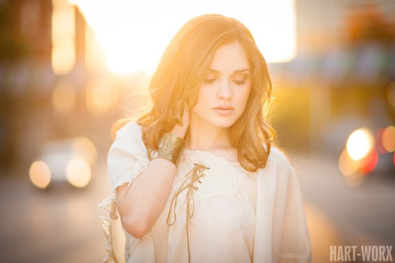 woman in white blouse at sunset
