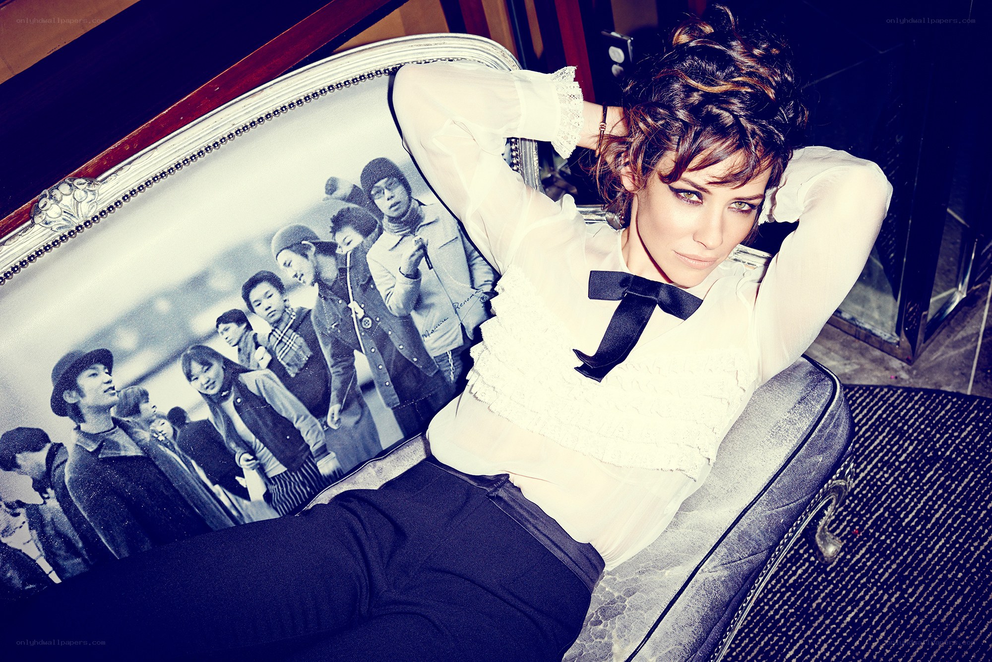 woman in white blouse on couch