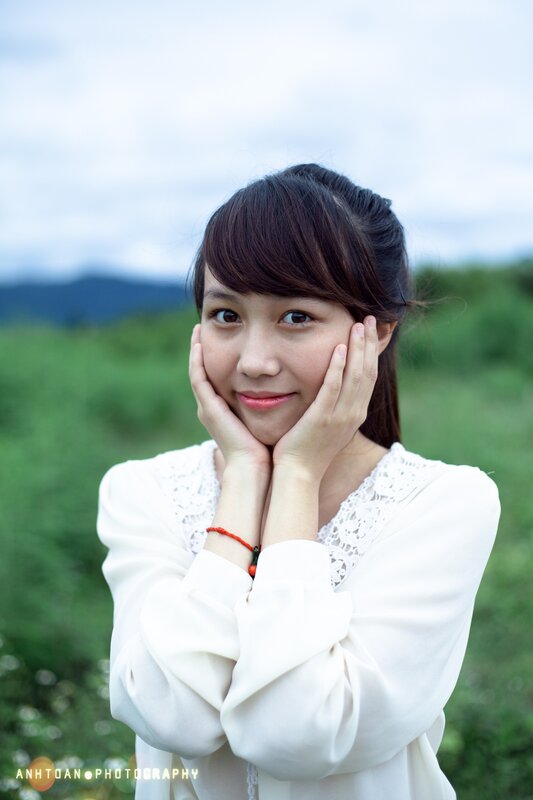 woman in white blouse outdoors