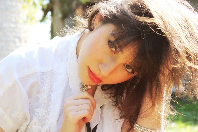 woman in white blouse outdoors