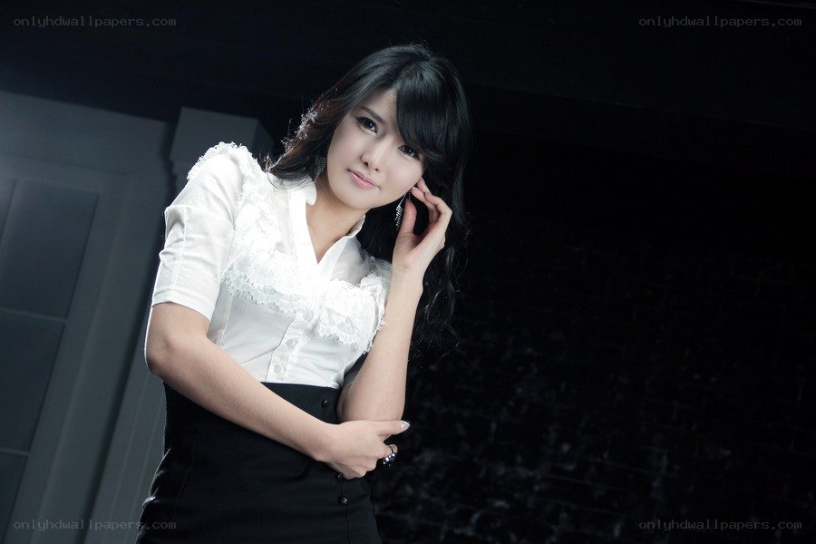 woman in white blouse posing