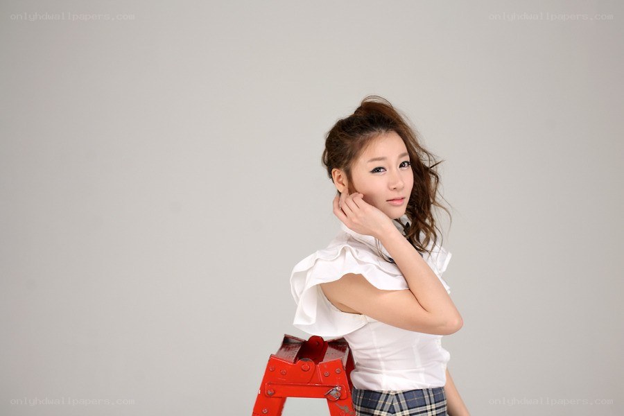 woman in white blouse posing