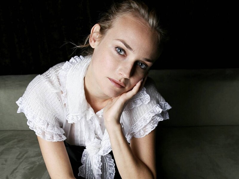 woman in white blouse resting
