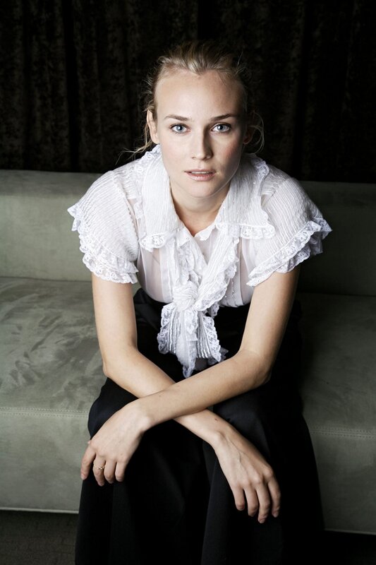 woman in white blouse sitting