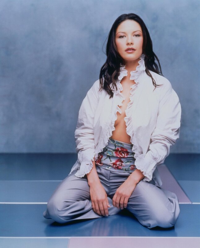 woman in white blouse sitting