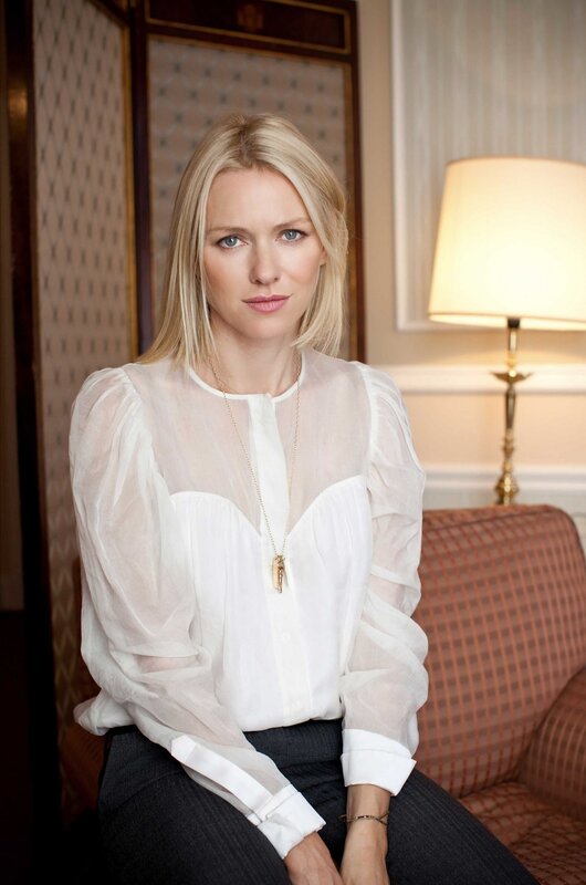 woman in white blouse sitting