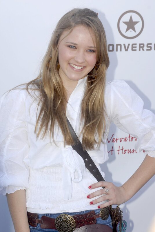 woman in white blouse smiling