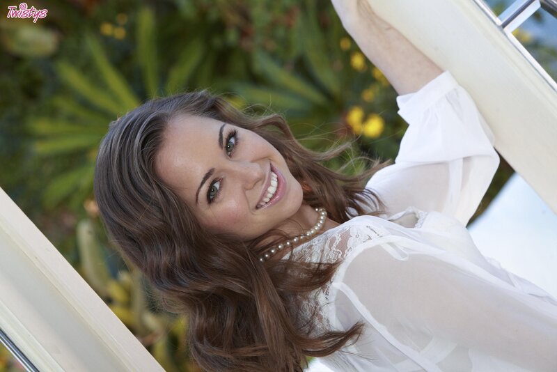 woman in white blouse smiling