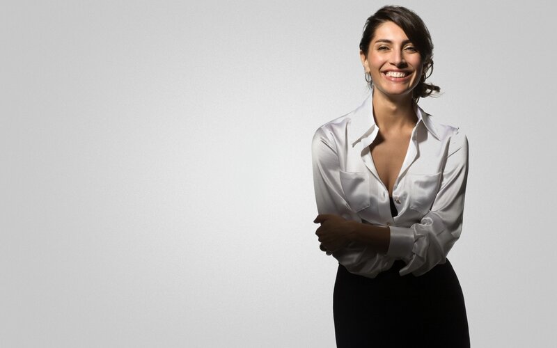 woman in white blouse smiling