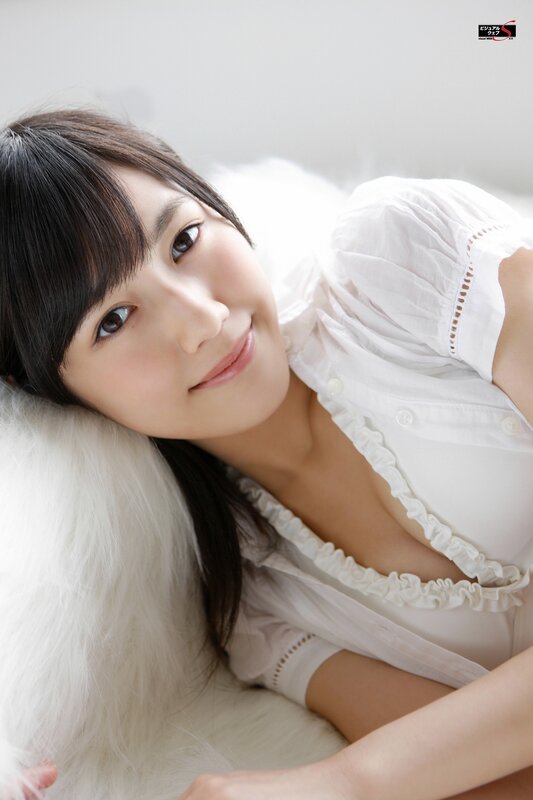 woman in white blouse smiling
