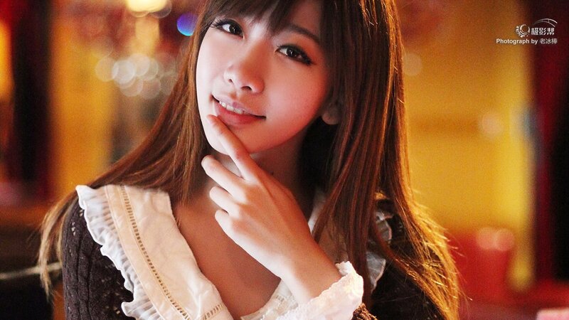 woman in white blouse smiling