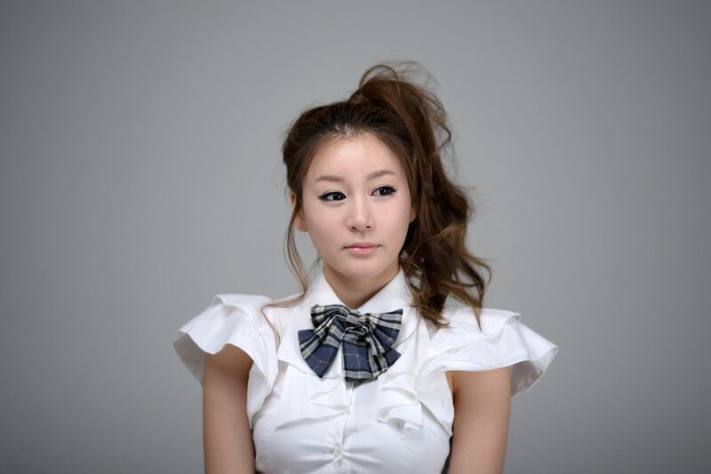 woman in white blouse with bow tie